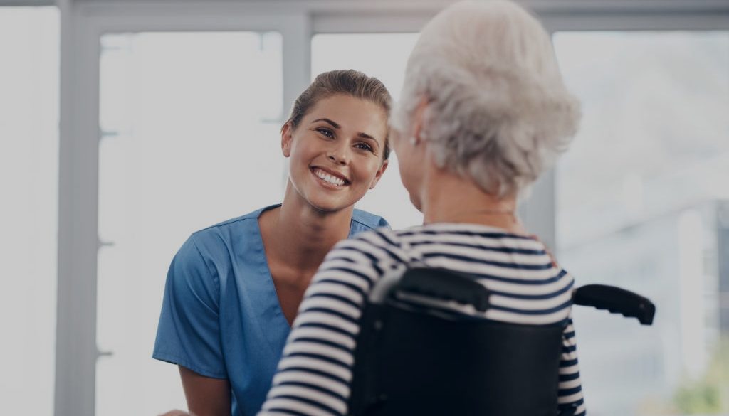 Shot of a senior woman in a wheelchair being cared for a nurse